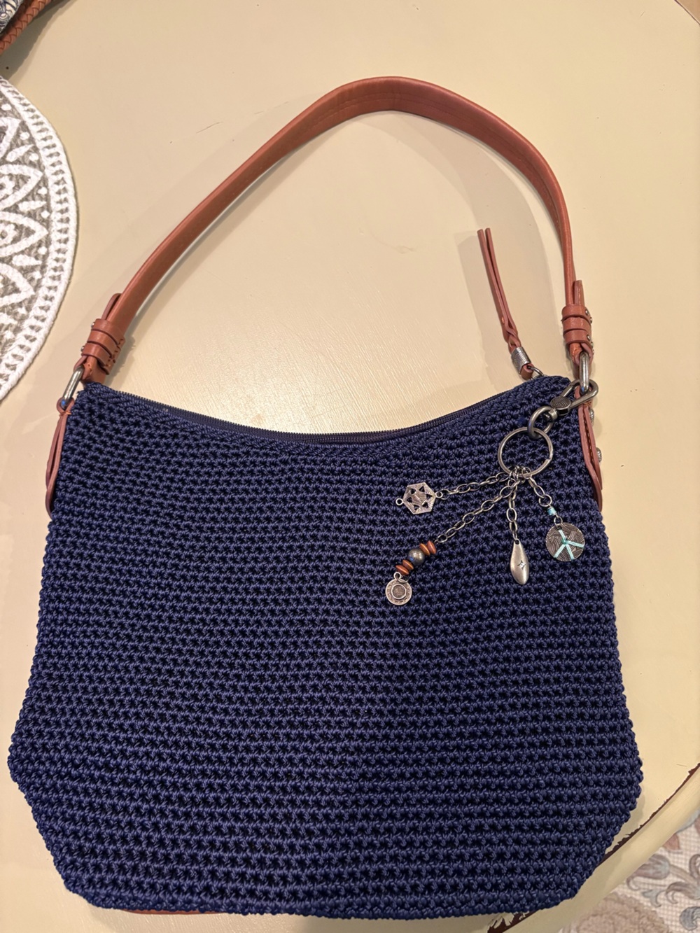 The Sak Navy Knit Shoulder Bag with Brown Leather Strap and Charm